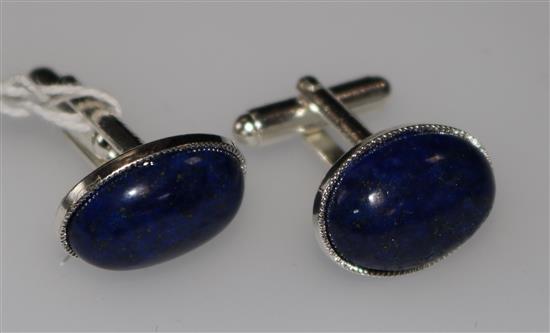 A pair of lapis lazuli cufflinks.